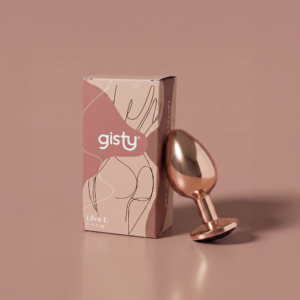 Elva L — metalowy korek analny w kolorze rose gold, widok z boku, obok pudełko gisty