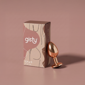 Elva S — metalowy korek analny w kolorze rose gold, widok z boku, obok pudełko gisty
